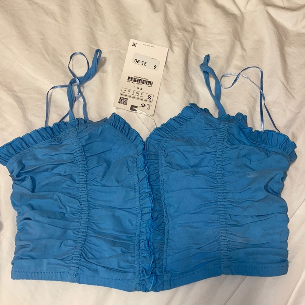 Blue crop top. never been worn, with tags.